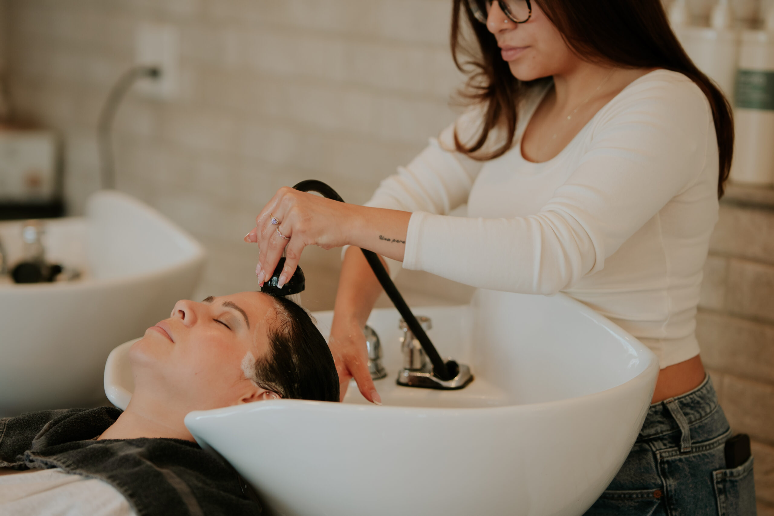 Hair color specialist working with a client at Philip Edward Salon in Boston